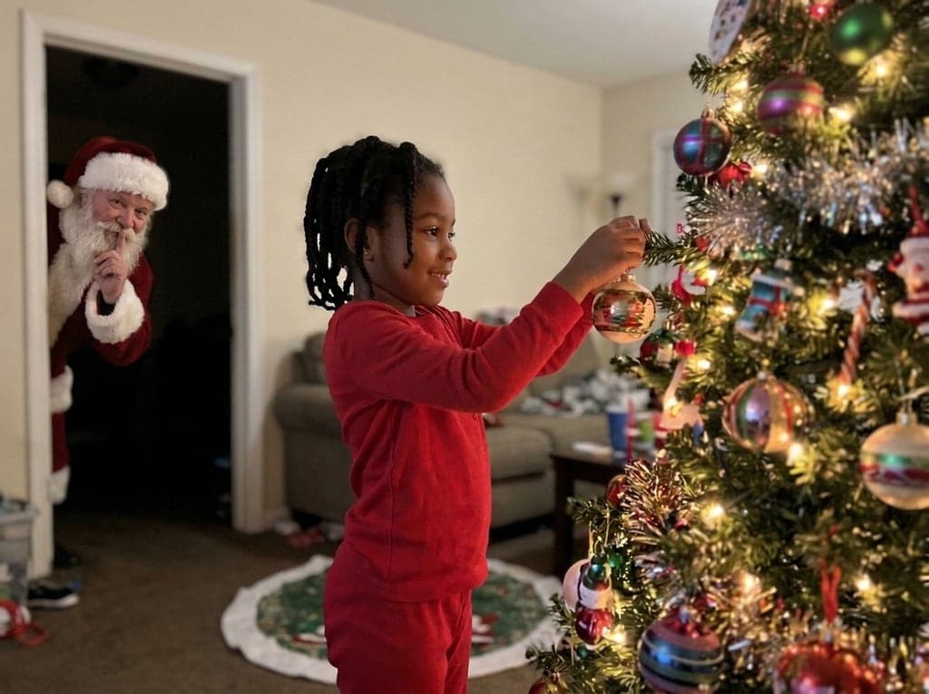 Girl at the tree, Santa peeks in